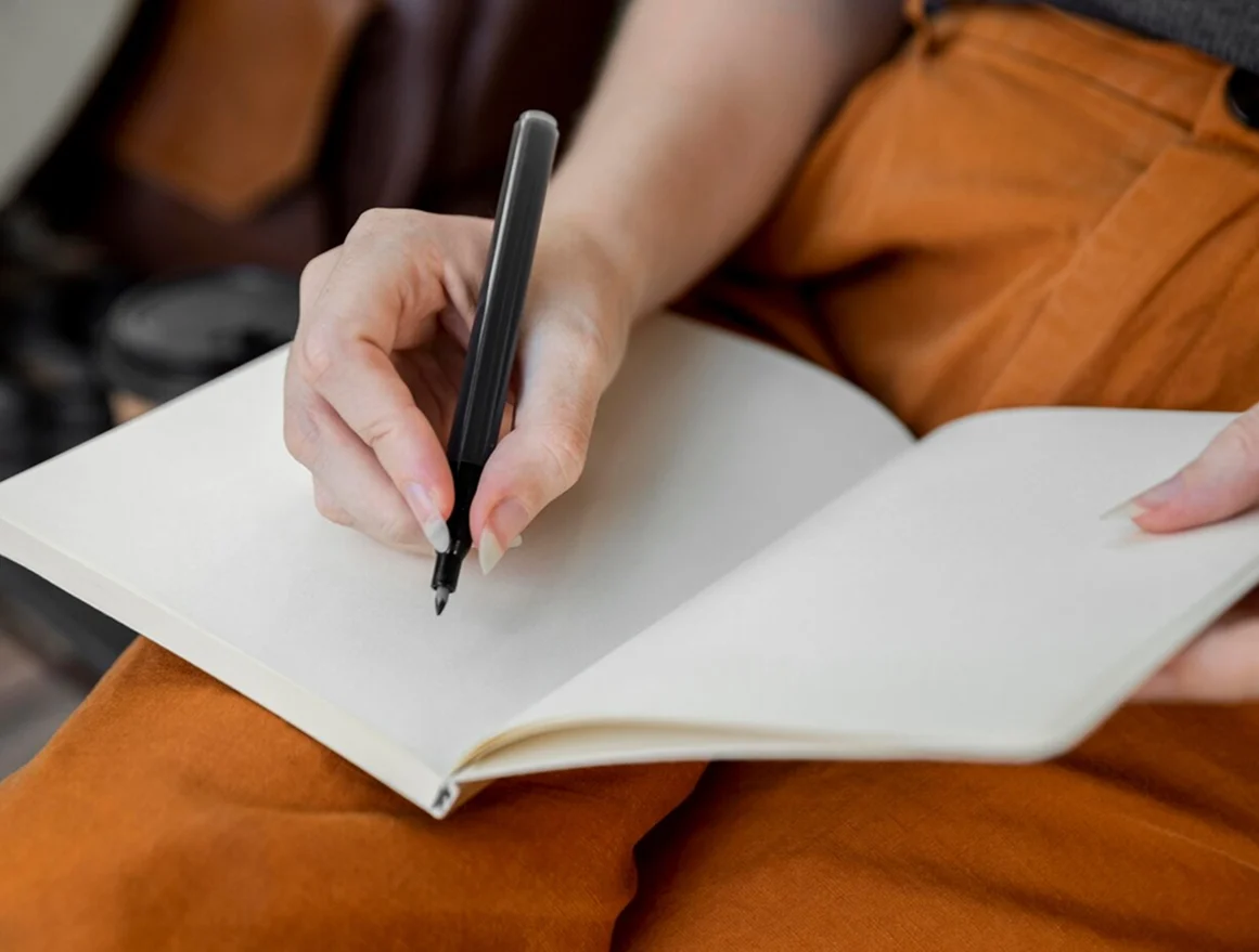 Hand writing in notebook